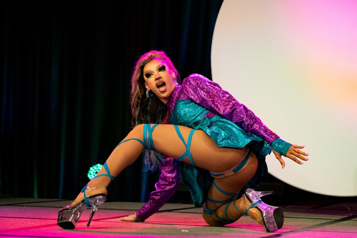 Colorado State University drag show headliner Mirage kneels onstage during her first number April 14. Mirage was a contestant in Season 16 of the reality show “RuPaul’s Drag Race.”