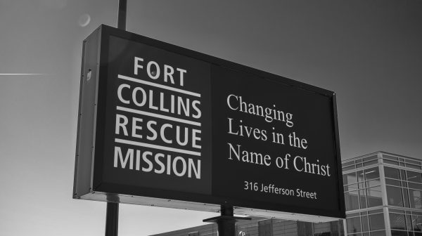 The Fort Collins Rescue Mission sign stands at its location and displays its mission statement, Changing Lives in the Name of Christ March 18. 