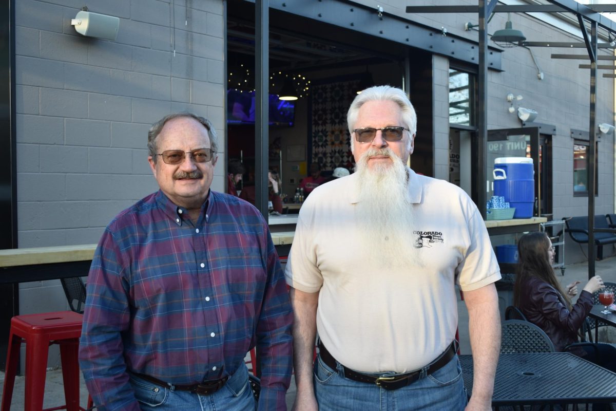 Colorado Blues Society Vice President Mark Schleiger and Treasurer Joe Menke stand in front of Maxline Brewing, one of their favorite places meet in Fort Collins April 2.
