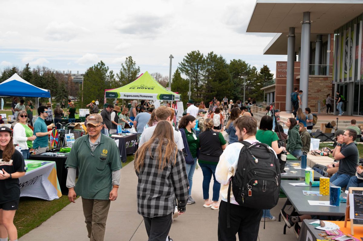 Students walk through the Colorado State University Earth Day Festival on April 22.