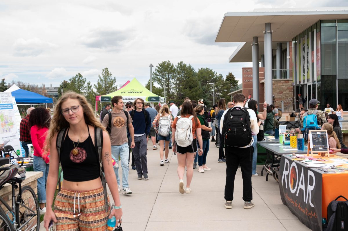 Students walk through the Colorado State University Earth Day Festival on April 22.