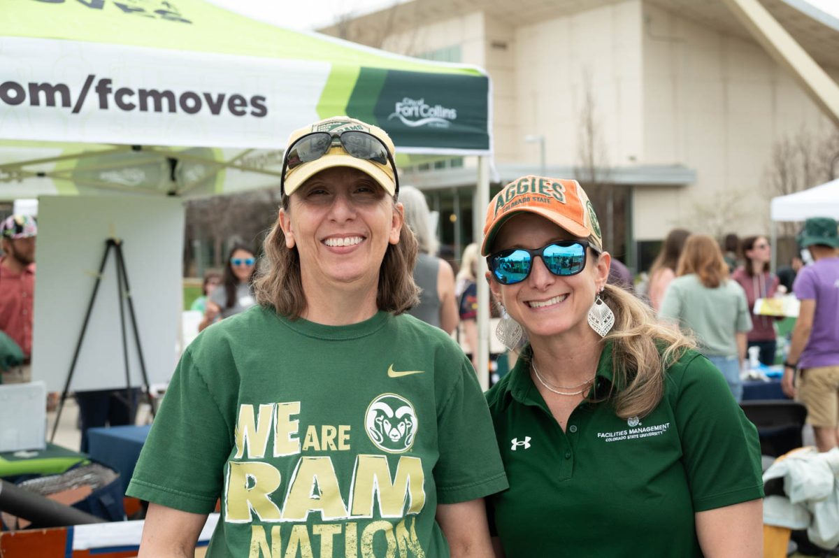 Heidi Mechtenberch (L), and Brit McCullar (R) pose at their Clean Water station hoping to educate the public on how impactful pollution is to our waters. CSU Earth Day Festival April 22 