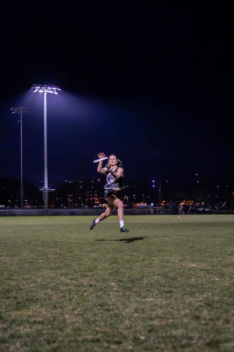 A member of the Colorado State University Womxn's Ultimate frisbee club team  "Hell's Belles" catches the frisbee at practice. Apr. 4.