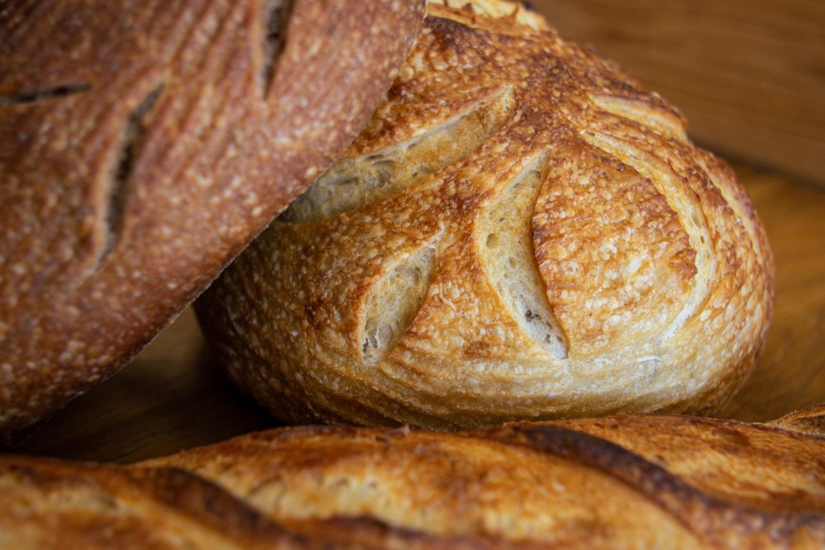 A+rye+loaf%2C+rosemary+sourdough+loaf+and+baguette+are+shown+stacked+on+top+of+each+other+April+8.+The+Bread+Chic%2C+a+Fort+Collins+bakery%2C+offers+freshly+baked+pastries+and+bread+every+day+of+the+week.+