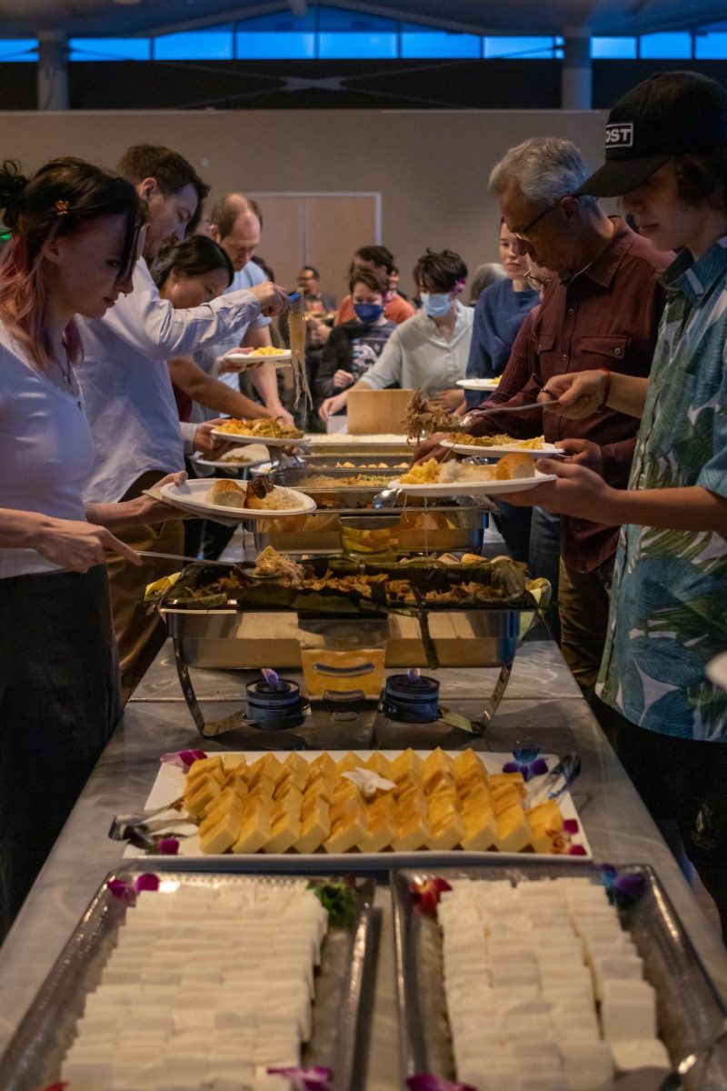 Lūʻau guests fill their plates with options like Kalua pig, Huli Huli Chicken, Mac salad, Chickem long rice, Poi, and Haupia, Butter Mochi and cake for desert. Apr 20.