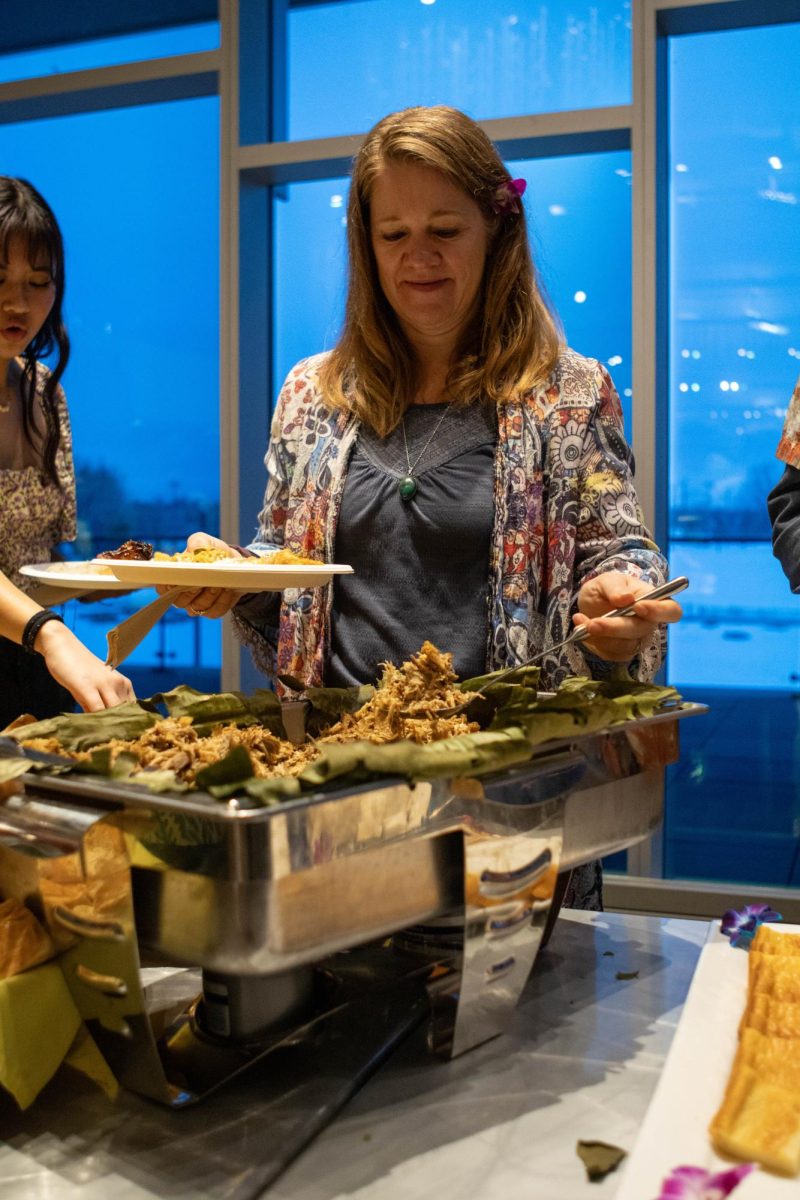 Brooke Scurlock, a lūʻau guest serves herself Kalua pig at the Asian Pacific American Cultural Center's 40th birthday lūʻau. Apr. 20.