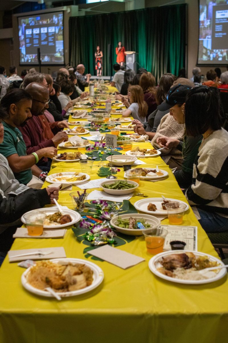 Dozens of lūʻau guests eat and celebrate the Asian Pacific American Cultural Center's 40th birthday. Apr. 20.