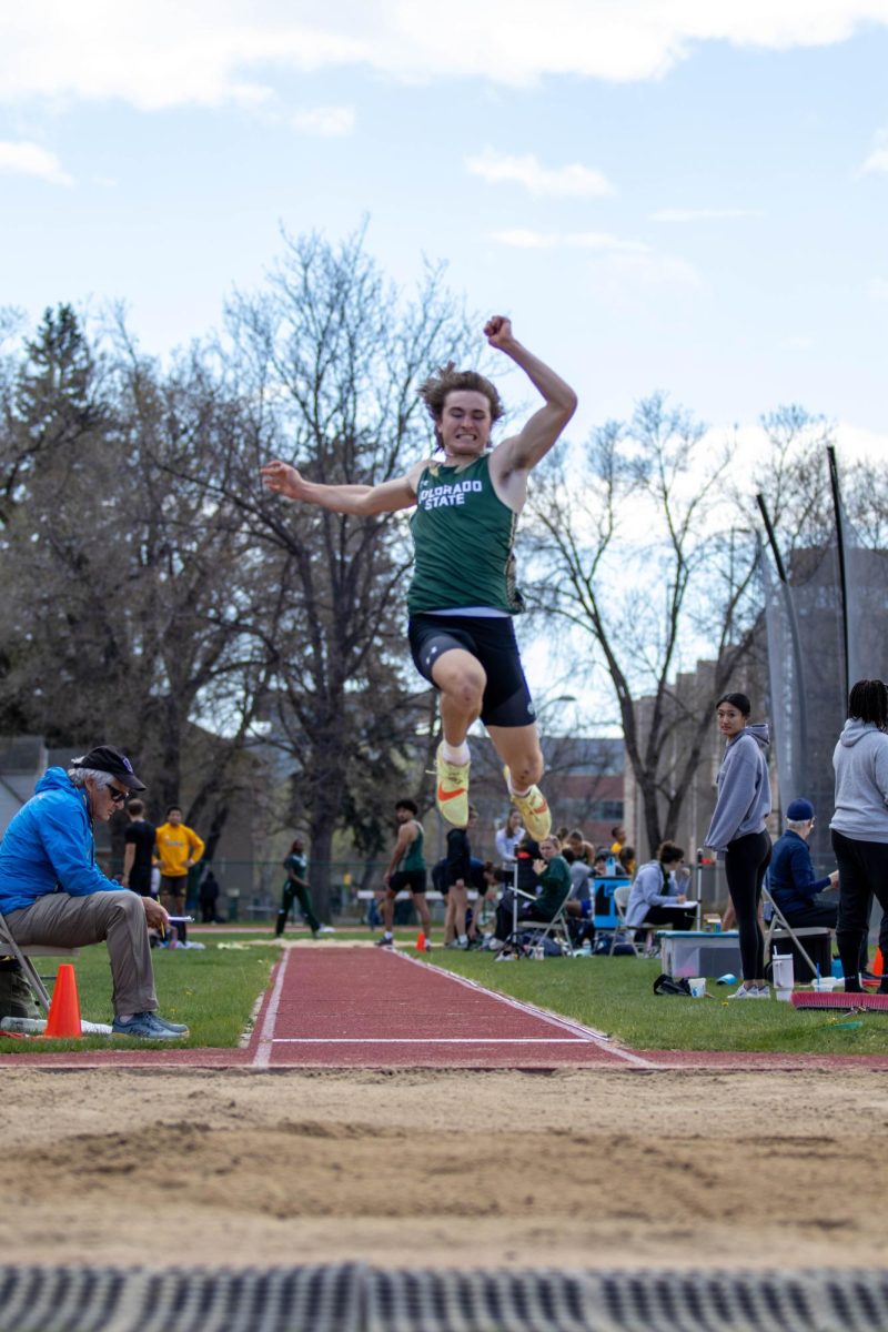 Tyler Bennet jumps in the mens long jump at the Doug Max Invitational. Apr. 28.