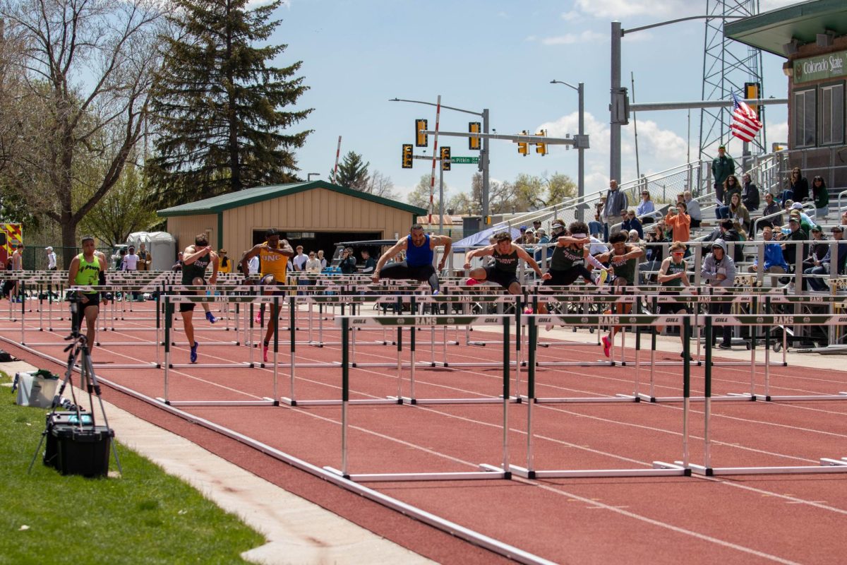 Student athletes participate in the men's 110 meter hurdles. Apr. 28.