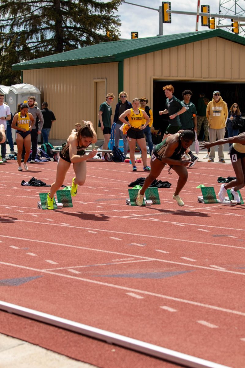 Colorado State University track and field athletes run in the women's 100 meter dash. Apr. 28.