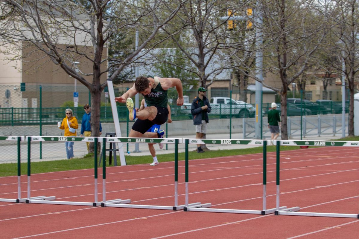 A Colorado State University Track and Field athlete leaps over hurdles on the Jack Christiansen Track. Apr. 28.