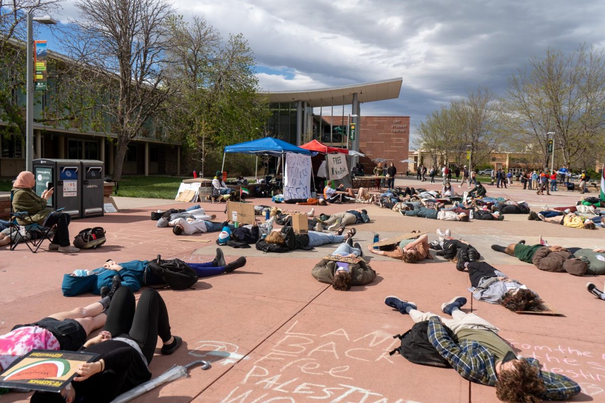 Protesters participate in a die-in outside the Lory Student Center during a Students for Justice in Palestine protest May 1. The protest ended at 7 p.m. in accordance with university policy. 
