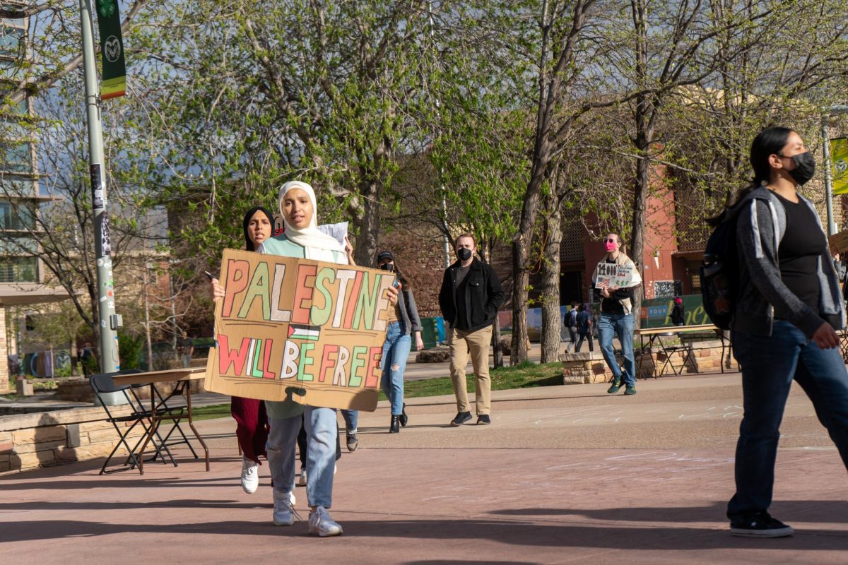 Protestors march with signs demanding for a ceasefire in Gaza outside the Lory Student Center Plaza during a Students for Justice in Palestine protest on May 1. The protest included chanting and marching in support of Palestine  The protest included chanting and marching in support of Palestinians and demanded Colorado State University calls for a ceasefire in Gaza.