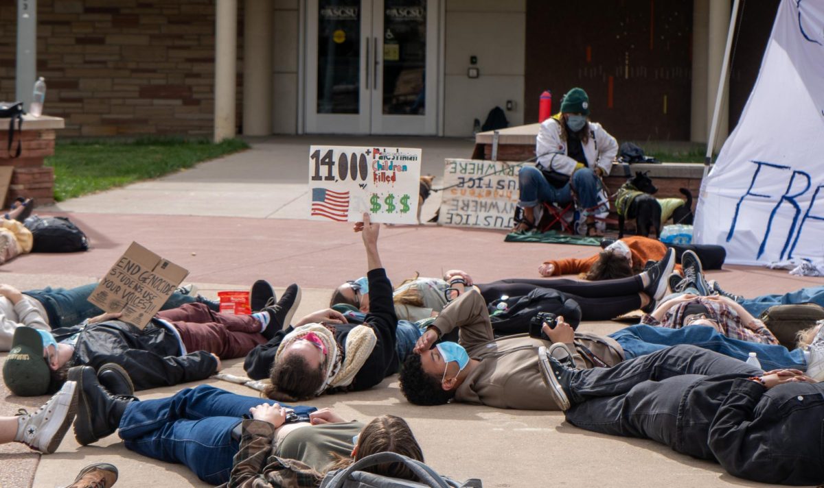 Protestors gather outside the Lory Student Center Plaza during a Students for Justice in Palestine protest on May 1. The protest included chanting and marching in support of Palestine from 1 to 7 p.m. The protest included a die-in demonstration. 