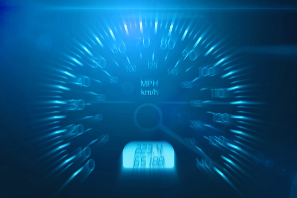 A slightly distorted close-up of a glowing blue car speedometer.