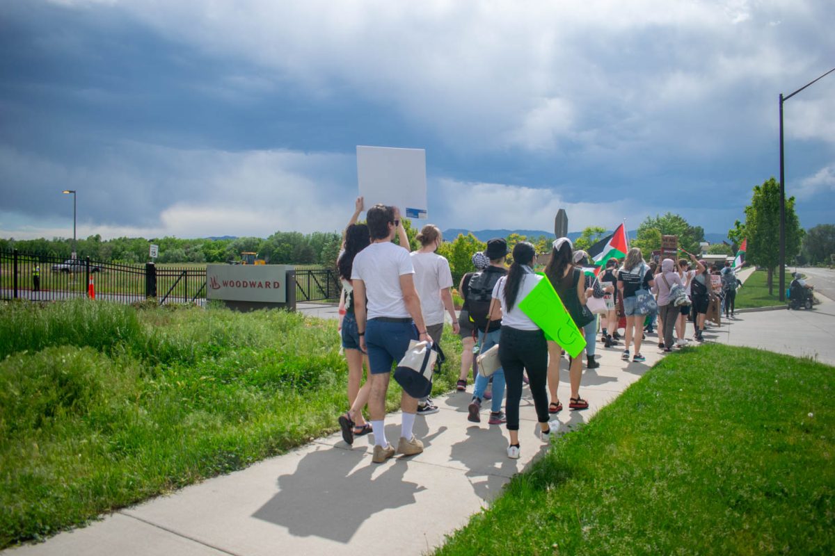 Members of the Fort Collins community gather in a protest outside the headquarters of aerospace and industrial manufacturer Woodward June 1. Fragments of munitions provided to the Israeli army by Woodward were found at the site of the May 27 bombing of Rafah in the Gaza Strip.