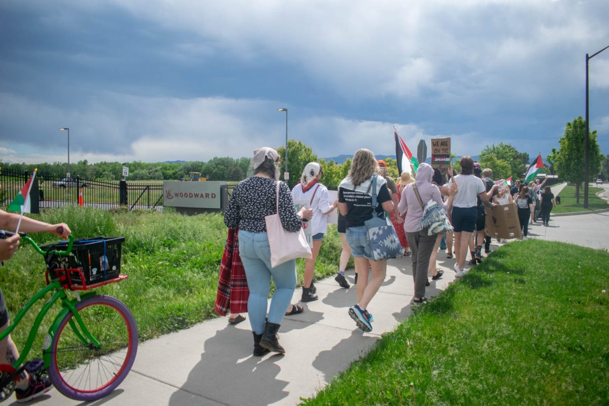 Members of the Fort Collins community gather in a protest outside the headquarters of aerospace and industrial manufacturer Woodward June 1. Fragments of munitions provided to the Israeli army by Woodward were found at the site of the May 27 bombing of Rafah in the Gaza Strip.