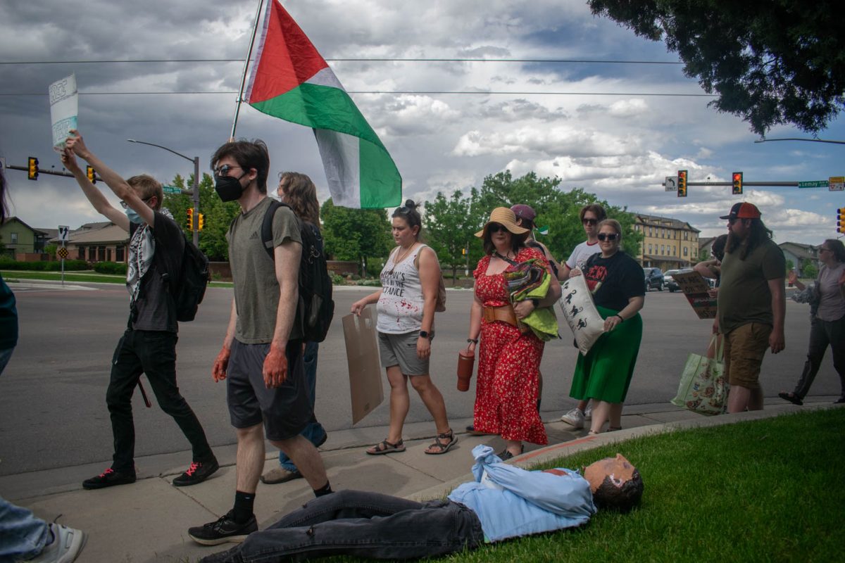 Members of the Fort Collins community march in a demonstration outside the headquarters of aerospace and industrial manufacturer Woodward June 1. Fragments of munitions provided to the Israeli military by Woodward were found at the site of the May 27 bombing of the Gazan city of Rafah.