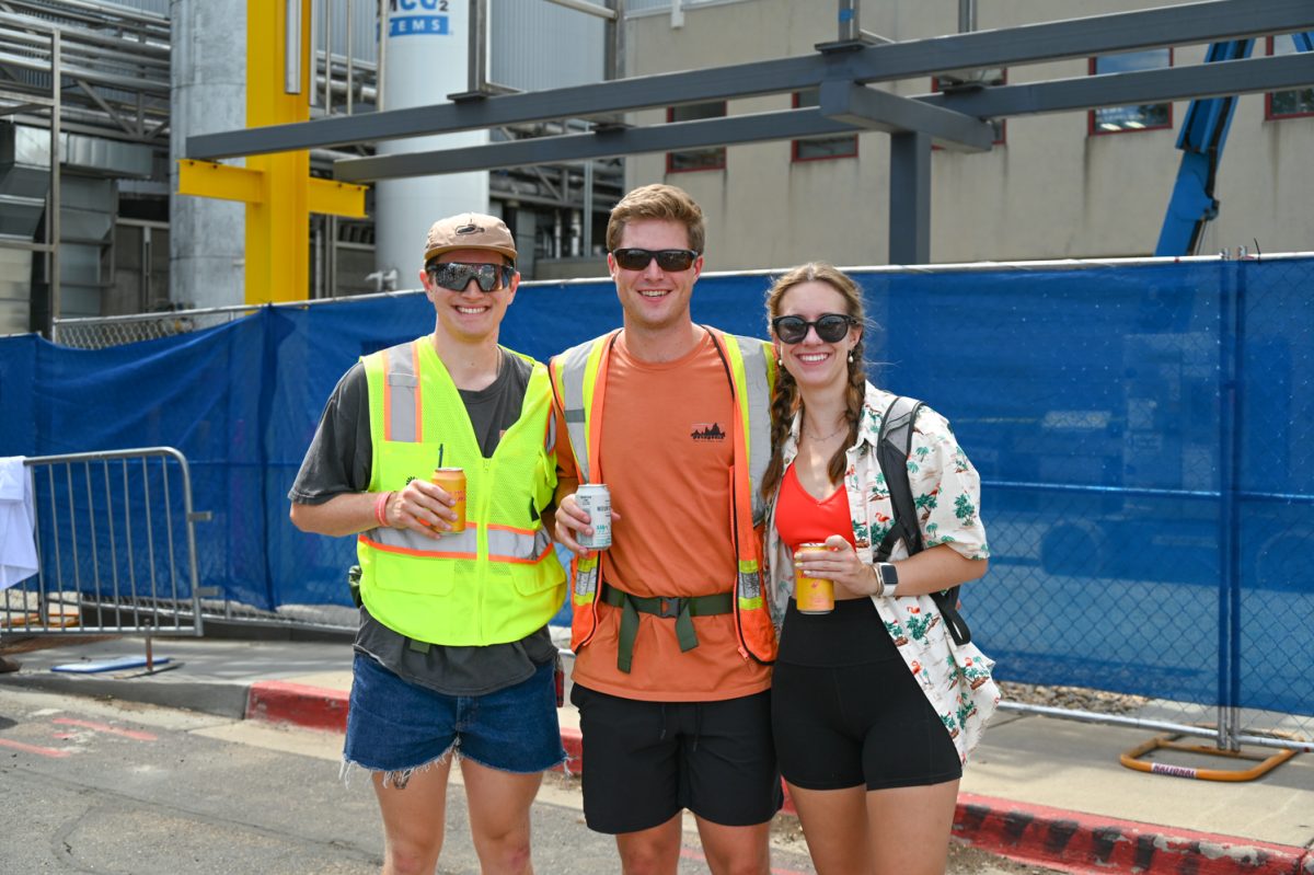 Grant Willsie (L), Sawyer Lascewicz (Center), and Kyra Mazanec (R) enjoy some  beers near the New Belgium Main Stage during this years Tour De Fat on August 24, 2024.