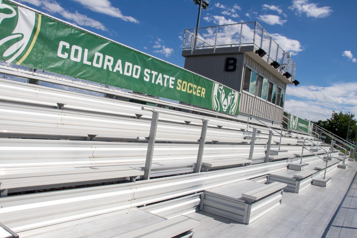 Empty stadium seats with a banner on the top that says "Colorado State Soccer."