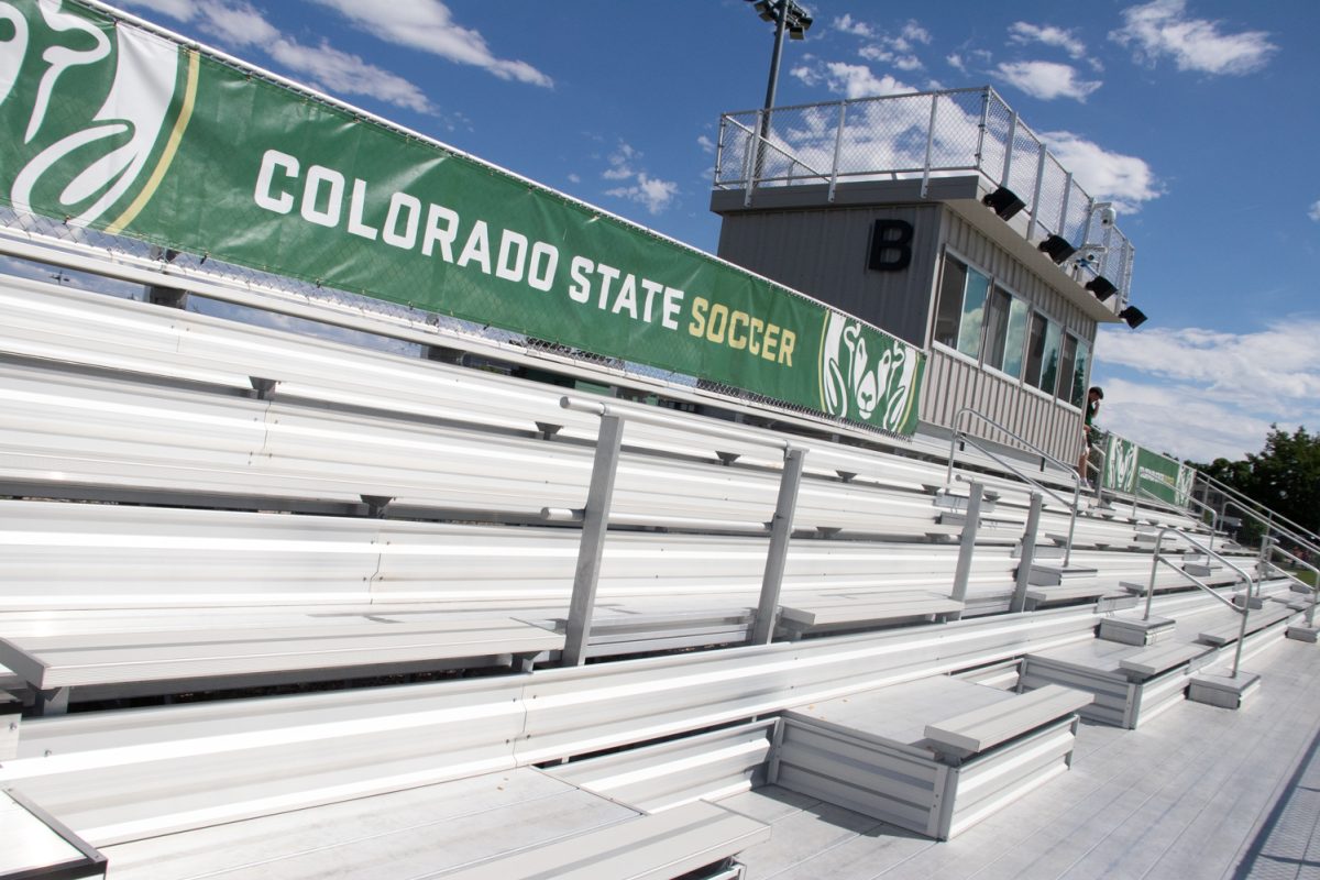 Empty stadium seats with a banner on the top that says "Colorado State Soccer."