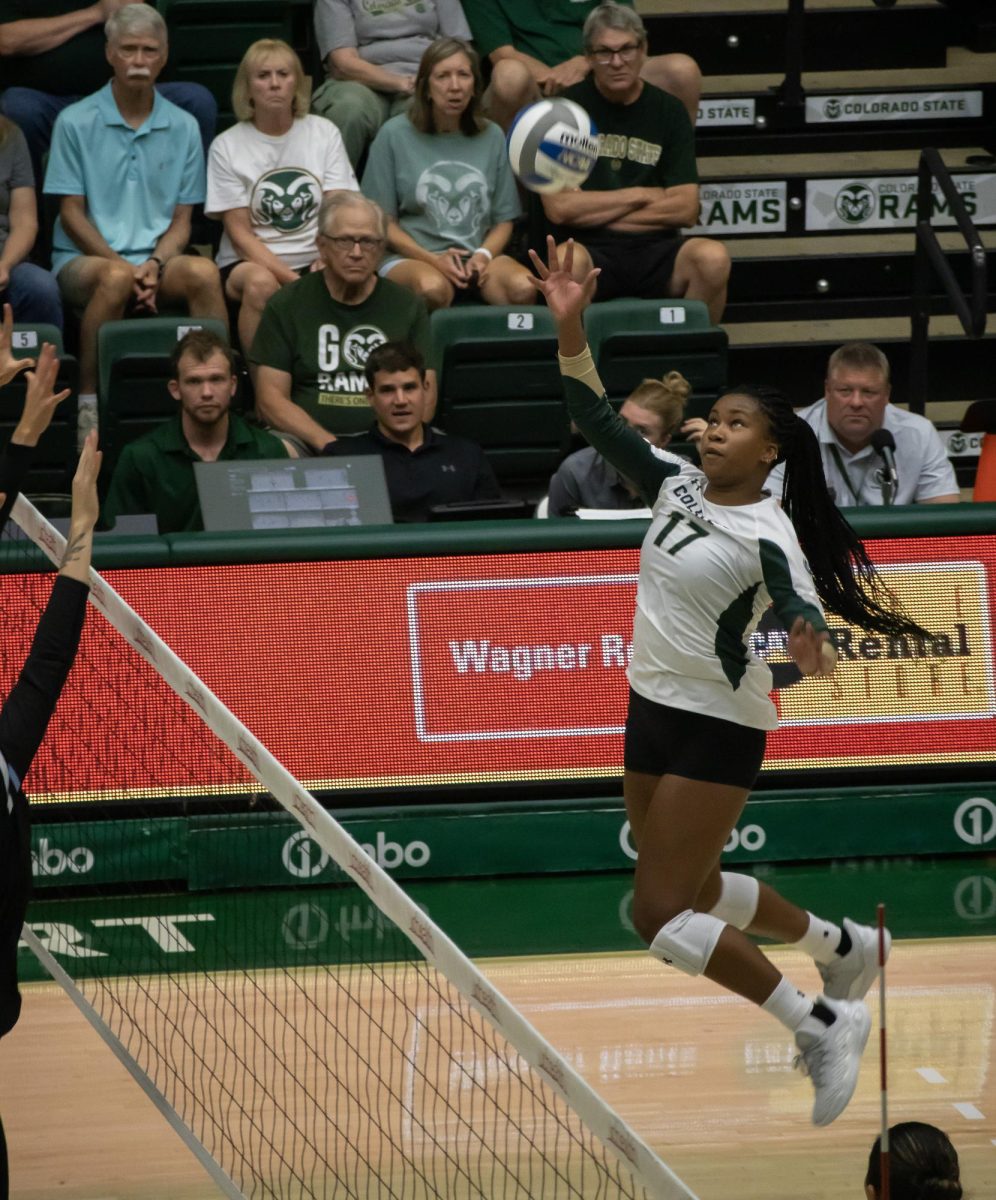 Kennedy Stanford (17) hits the ball over the net to score a point for the Colorado State Women's Volleyball Team vs Creighton University on August 24. 