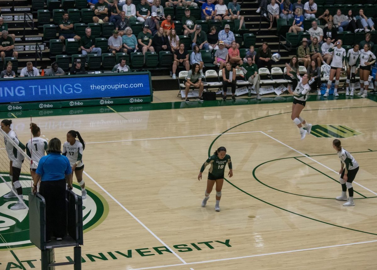 Emery Herman (4) serves the ball over the net during the second set of the game vs Creighton University on August 24. 