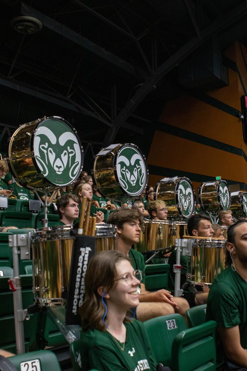 The Colorado State University marching band listen to speeches and wait for their turn to cheer on the Rams at convocation in Moby Arena. Aug. 16.
