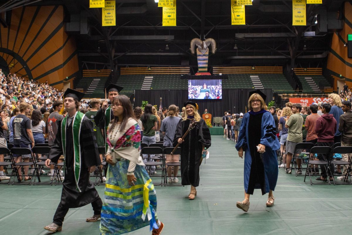 Colorado State University ASCSU president Nick DeSalvo and Vice Presidet Braxton Dietz walk out of the convocation ceremony alongside CSU president Amy Parsons. Aug. 16.