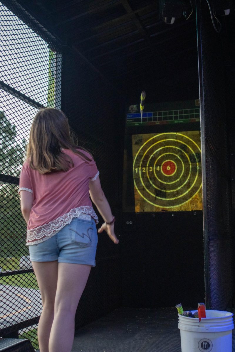 Colorado State University student Ashley Tieszen participates in axe throwing at Ramapalooza. Aug.16