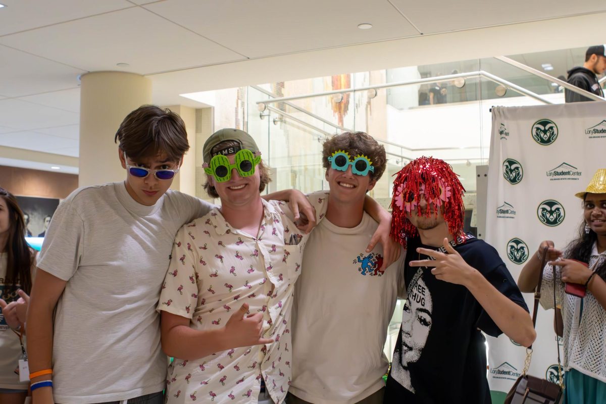 Colorado State University students Avery Burcham, Eli Burbach, Gude Walters, and Edison Macomber prepare for their Ramapalooza polaroid. Aug.16.