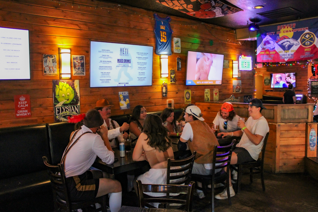 A group of friends celebrate Oktoberfest at Yeti Bar and Grill Sept. 28.