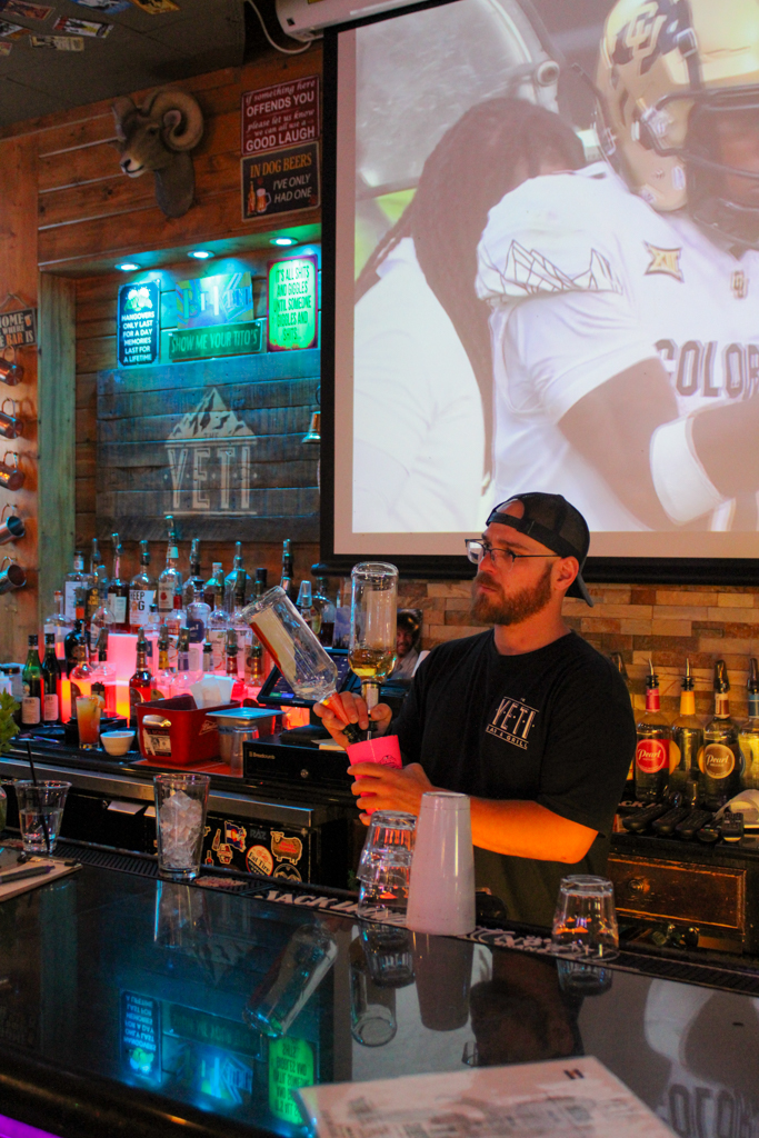 Seth Kimball, a bartender at Yeti Bar and Grill, makes a drink Sept. 28.