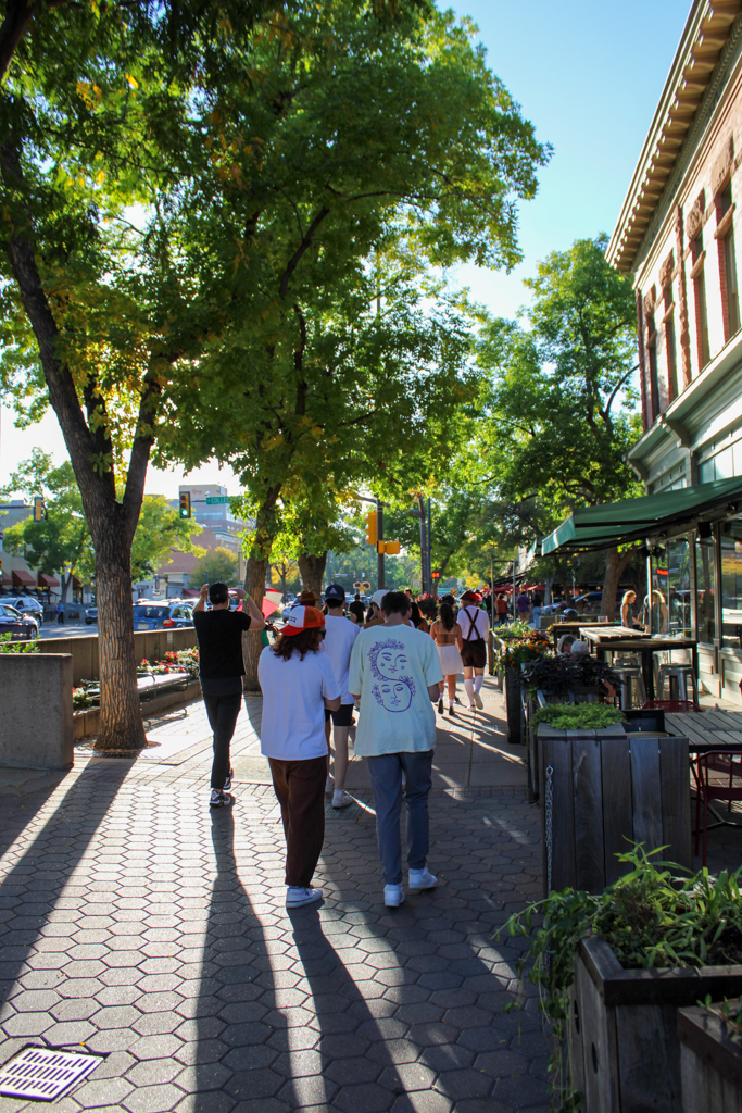 Fort Collins locals walk to Brothers Bar and Grill during the Oktoberfest Pub Crawl Sept. 28.