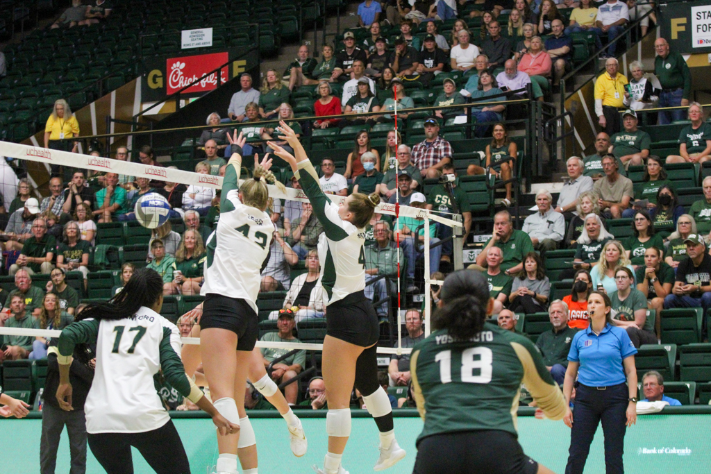 Karina Leber (42) and Emery Herman (4) block a hit from the University of Colorado Sept. 19.