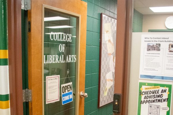 An open door that says "College of Liberal Arts" on it.