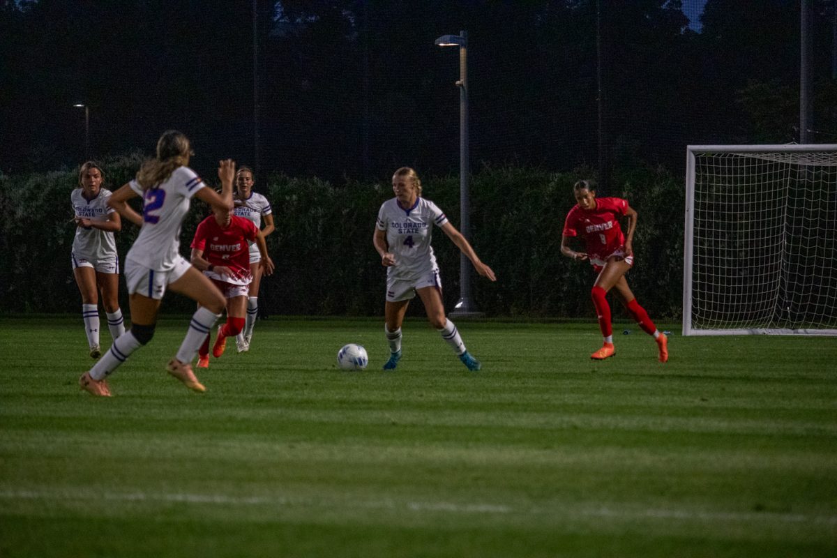 A soccer player prepares to pass the ball.