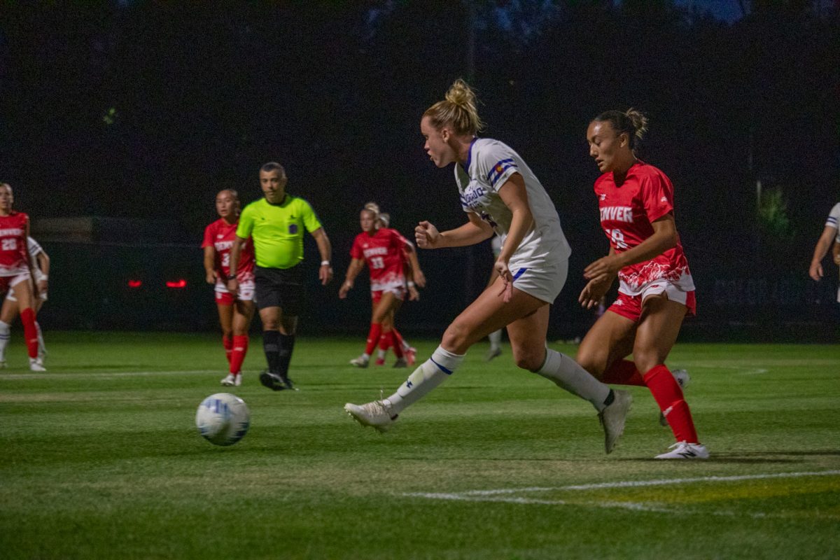 A soccer player kicking a ball.