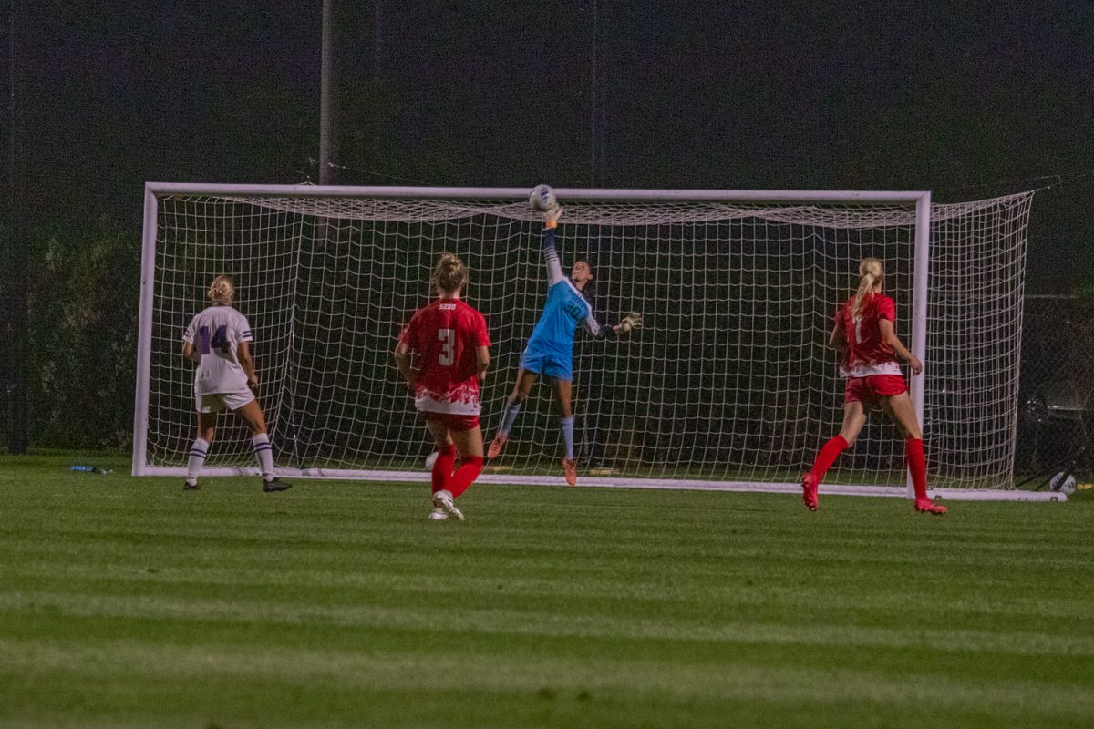 A goaltender jumps to block a ball from going in their goal.