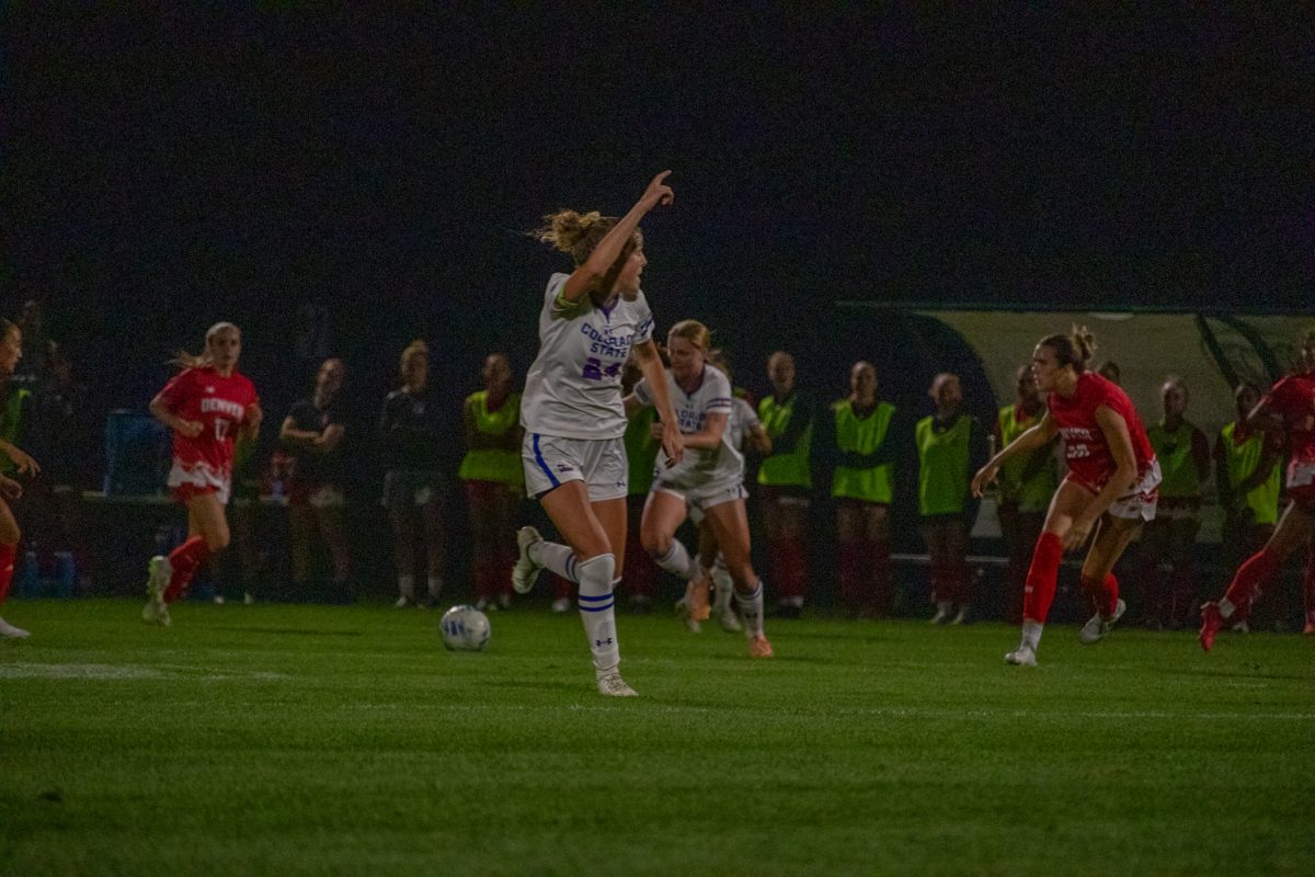 A soccer player runs upfield.