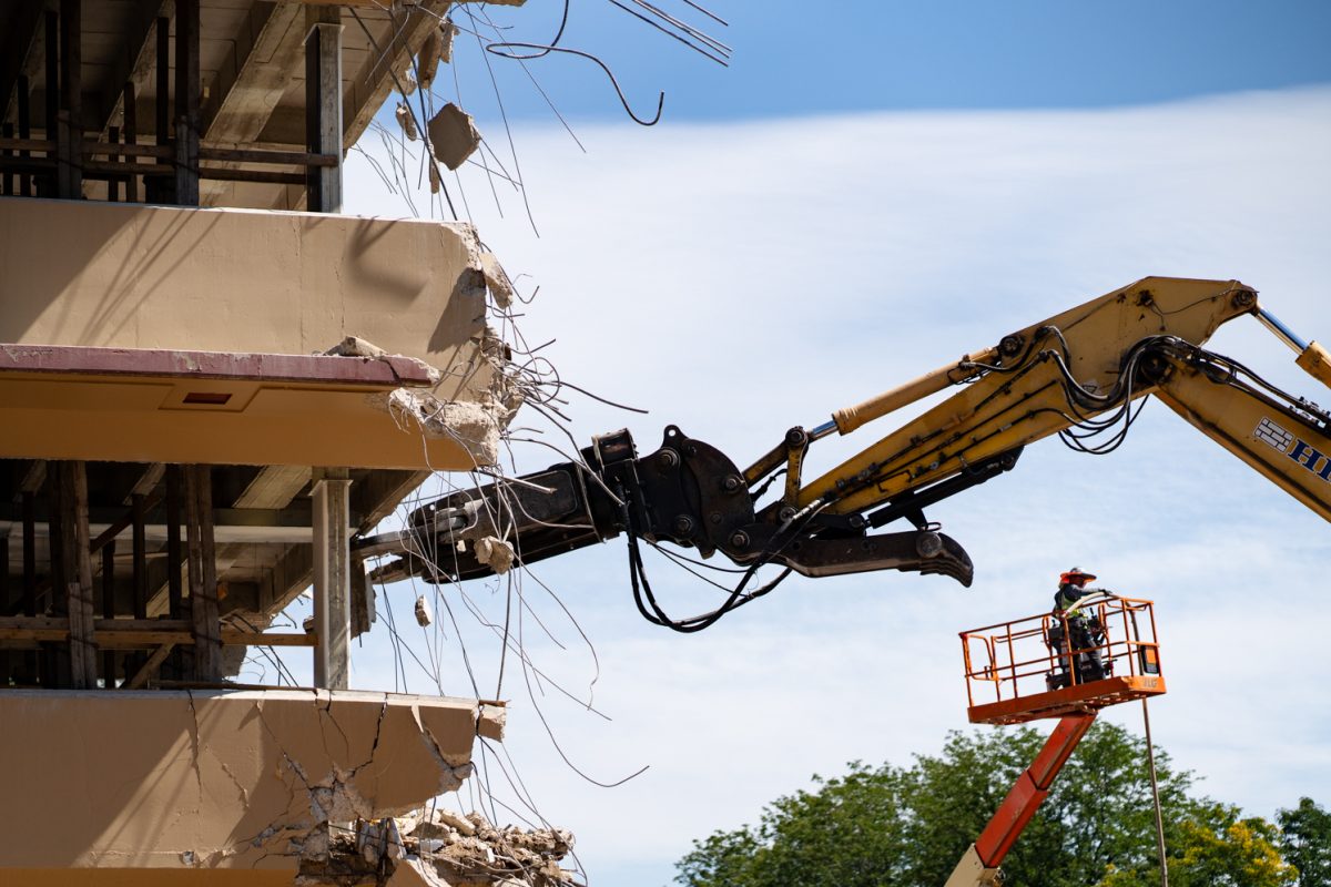 A material handling excavator removes debris from Clark B during demolition Sept. 12. The renovations, set to be complete by 2027, have seen the removal of the B wing of Clark. 