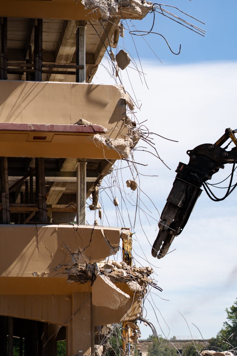 A material handling excavator removes debris from Clark B during demolition Sept. 12. The renovations, set to be complete by 2027, have seen the removal of the B wing of Clark. 