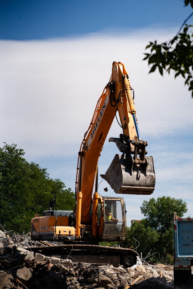 An excavator removes rubble from a pile during Clark demolition Sept. 12. Demolition of Clark B progresses Sept. 12. The renovations, set to be complete by 2027, have seen the removal of the B wing of Clark. 