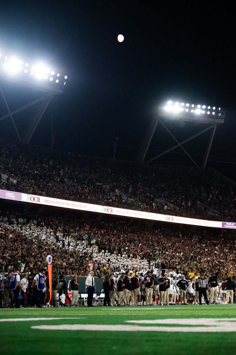 A full stadium under the moon.