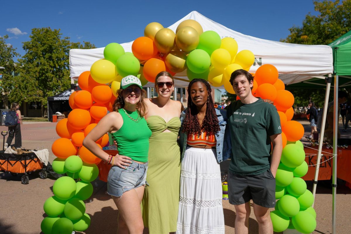 Associated Students of Colorado State University Director of Basic Needs Jorja Whyte, Deputy Director of Basic Needs Lauren Johnson, intern Evan Achebe and lead intern Nathan McCabe stand at the entrance of the Wellness Wonderland event on Sept. 20. McCabe and Achebe worked with the ASCSU Department of Basic Needs to host the Wellness Wonderland event. 