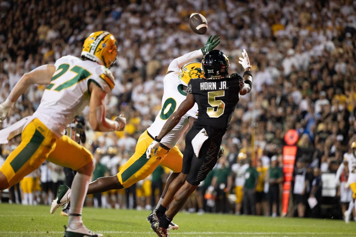 North Dakota State University's Marcus Gulley (0) deflects a pass intended for the University of Colorado Boulder's Jimmy Horn Jr. during the schools' football game at Folsom Field Aug. 29.