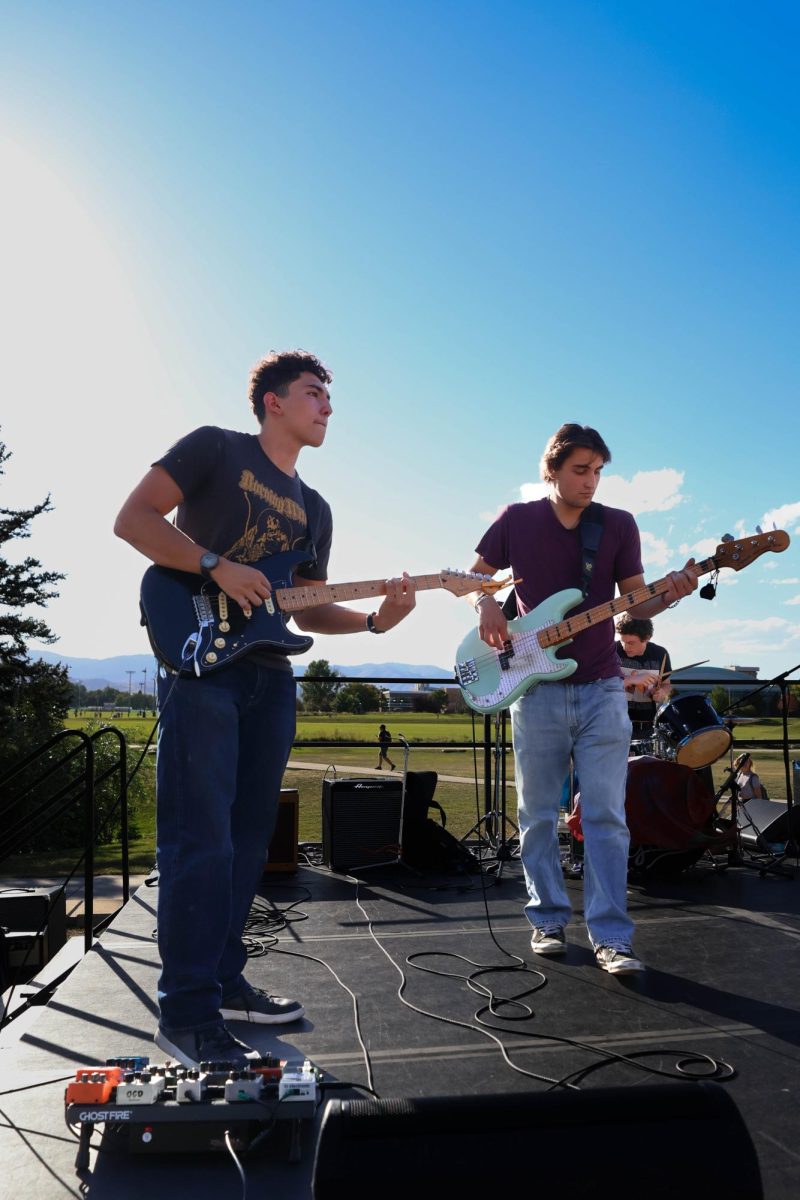 Band mates Nick Salis and Isaac Salsberry preform with their band, Heliotrope, for annual Battle of the Band competition on Sept. 19. 