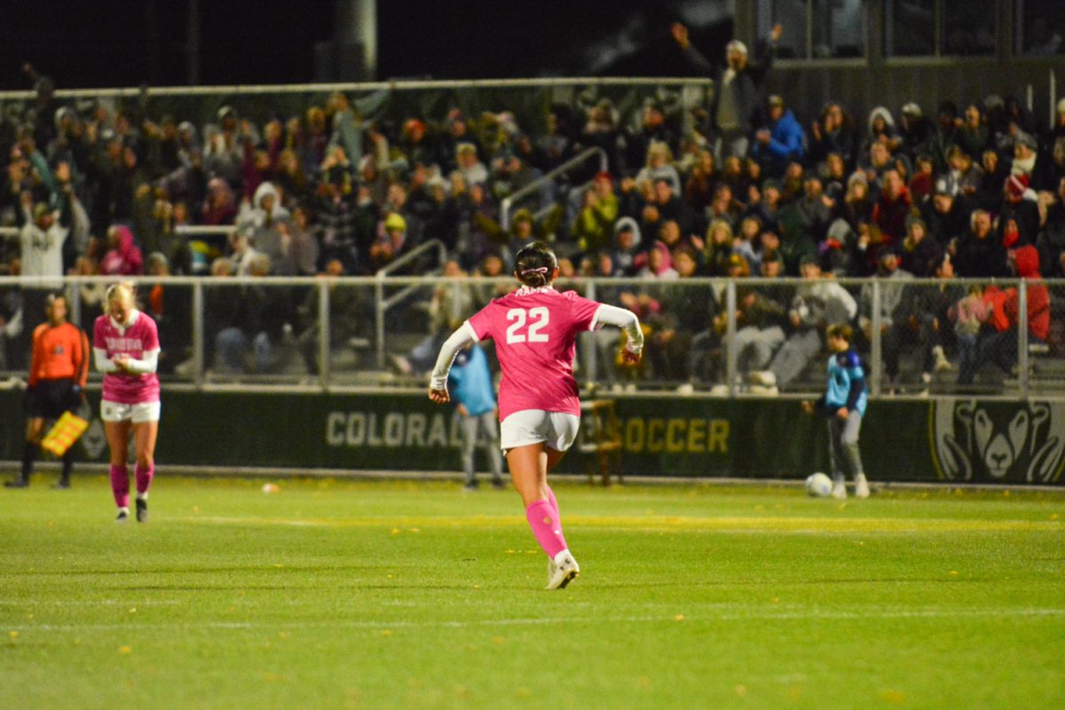Girl in pink jersey celebrating