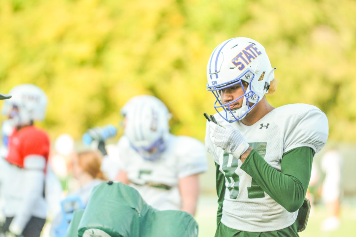 A CSU football player waiting to run a drill during practice. 