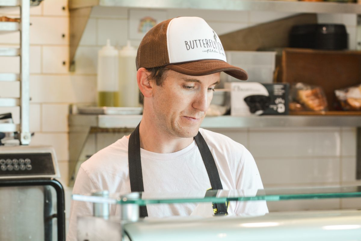 A barista looking at which options there are on display